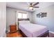 Cozy bedroom with hardwood floors, a comfortable bed, and natural light from the window at 5301 Kalmia Dr, Las Vegas, NV 89103