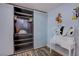 Walk-in closet with custom shelving and dressing table, provides optimal storage and organization at 5301 Kalmia Dr, Las Vegas, NV 89103