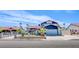 Charming home featuring a red tile roof, landscaped front yard, and an attached two-car garage at 5301 Kalmia Dr, Las Vegas, NV 89103