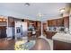 Modern kitchen with granite countertops, stainless steel appliances, and access to the dining area at 5301 Kalmia Dr, Las Vegas, NV 89103
