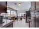 Spacious kitchen featuring granite countertops, stainless steel appliances, and a breakfast bar area at 5301 Kalmia Dr, Las Vegas, NV 89103
