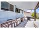 Outdoor kitchen under covered patio featuring built-in grill, bar, sink and a tv at 5301 Kalmia Dr, Las Vegas, NV 89103