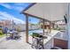 Covered patio featuring a built-in outdoor kitchen and grill next to the pool at 5301 Kalmia Dr, Las Vegas, NV 89103