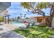 Community pool area offers ample seating, hammocks, grassy areas, and a beach-themed decorative wall at 5301 Kalmia Dr, Las Vegas, NV 89103