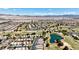Beautiful aerial view of a neighborhood situated alongside lush golf courses and tranquil lakes at 5681 Harbour Pointe Ave, Las Vegas, NV 89122