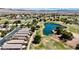 Expansive aerial view of homes situated near lush golf course with serene water features at 5681 Harbour Pointe Ave, Las Vegas, NV 89122