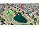 Beautiful aerial view of a property located next to Stallion Mountain Golf Club and a lake at 5681 Harbour Pointe Ave, Las Vegas, NV 89122
