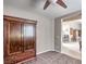 Bedroom with carpet, ceiling fan and an open view to a dining area and kitchen at 5681 Harbour Pointe Ave, Las Vegas, NV 89122