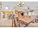 Bright dining area with open view into the kitchen and living space, featuring stylish lighting at 5681 Harbour Pointe Ave, Las Vegas, NV 89122