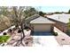 Home featuring desert landscaping, a two-car garage and a neutral color palette at 5681 Harbour Pointe Ave, Las Vegas, NV 89122