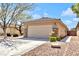 Charming single-story home with a two-car garage, rock landscaping, and desert foliage at 5681 Harbour Pointe Ave, Las Vegas, NV 89122