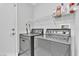 Laundry room features a side by side washer and dryer set beneath a wire shelf at 5681 Harbour Pointe Ave, Las Vegas, NV 89122
