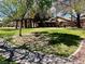Scenic community park with lush grass, mature trees and shaded seating area at 5681 Harbour Pointe Ave, Las Vegas, NV 89122