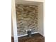 Close-up of the unique stone accent wall in the living room, adding texture and style to the interior at 5904 Oakton St, Las Vegas, NV 89130
