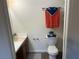 This bathroom features a vanity with cabinet, a toilet and a towel rack at 5904 Oakton St, Las Vegas, NV 89130