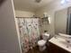 Bathroom featuring shower with decorative curtain and a toilet at 5904 Oakton St, Las Vegas, NV 89130