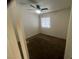 This carpeted bedroom features a ceiling fan and a window for natural light at 5904 Oakton St, Las Vegas, NV 89130