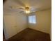 Bedroom features carpet, window with blinds, and a ceiling fan with light at 5904 Oakton St, Las Vegas, NV 89130