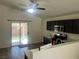 The kitchen features dark cabinets, stainless steel appliances, and a sliding glass door to the backyard at 5904 Oakton St, Las Vegas, NV 89130