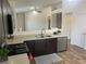 Bright kitchen with dark cabinets, stainless appliances, and a breakfast bar at 5904 Oakton St, Las Vegas, NV 89130
