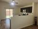 Modern kitchen features stainless steel appliances, dark wood cabinets, and an open layout with natural light at 5904 Oakton St, Las Vegas, NV 89130