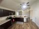 Spacious kitchen with dark cabinetry, stainless appliances, and hardwood floors at 5904 Oakton St, Las Vegas, NV 89130