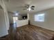Open-concept layout connecting the living room and kitchen with wood flooring and bright natural light at 5904 Oakton St, Las Vegas, NV 89130
