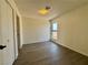 Bedroom with wood floors, window and neutral colored walls at 5928 Willard St, Las Vegas, NV 89122