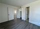 Inviting bedroom with new flooring, closet, and a neutral color palette, ready for personalization at 5928 Willard St, Las Vegas, NV 89122