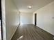 Bedroom with wood floors, window and neutral colored walls at 5928 Willard St, Las Vegas, NV 89122