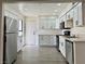 Bright kitchen features stainless steel appliances, white cabinets, and countertops with plenty of room to cook at 5928 Willard St, Las Vegas, NV 89122