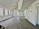 Open-concept living room with new flooring and bright, white walls that complement the space at 5928 Willard St, Las Vegas, NV 89122