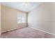 Bedroom with a window, ceiling fan, and carpeted floor at 6149 Elderberry Wine Ave, Las Vegas, NV 89142