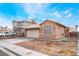 Attractive home featuring a two-car garage and easy-to-maintain landscaping at 6149 Elderberry Wine Ave, Las Vegas, NV 89142
