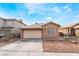 Charming single-story home with a two-car garage and well-maintained front yard at 6149 Elderberry Wine Ave, Las Vegas, NV 89142