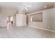 Open living room showcasing tile floors, neutral paint and airy layout at 6149 Elderberry Wine Ave, Las Vegas, NV 89142