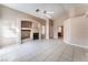 Cozy living room with tile flooring, fireplace and built-in shelving at 6149 Elderberry Wine Ave, Las Vegas, NV 89142