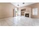 Light-filled living room featuring fireplace, built-ins, and sliding door at 6149 Elderberry Wine Ave, Las Vegas, NV 89142