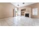 Light-filled living room featuring fireplace, built-ins, and sliding door at 6149 Elderberry Wine Ave, Las Vegas, NV 89142