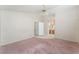 Spacious main bedroom leading to bathroom with vaulted ceilings and ceiling fan at 6149 Elderberry Wine Ave, Las Vegas, NV 89142