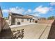 A spacious backyard features a concrete patio and a dirt yard, perfect for landscaping or outdoor activities at 6314 Shadow Moon Pl, North Las Vegas, NV 89031