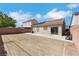 Spacious backyard showcases a stone fence, patio area, and exterior view of the home at 6314 Shadow Moon Pl, North Las Vegas, NV 89031