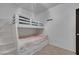 Pleasant bedroom featuring a bunk bed with attached stairs and soft pink themed bedding at 6314 Shadow Moon Pl, North Las Vegas, NV 89031
