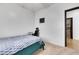 This bedroom shows a bed, a desk, a ceiling fan and a view into a tiled-floor closet space at 6314 Shadow Moon Pl, North Las Vegas, NV 89031