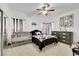 Cozy bedroom featuring modern decor, a crib, and stylish accents, creating a comfortable and inviting space at 6314 Shadow Moon Pl, North Las Vegas, NV 89031