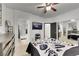 Well-lit primary bedroom offering an en-suite bathroom, TV, and mirrored closet, providing comfort and privacy at 6314 Shadow Moon Pl, North Las Vegas, NV 89031