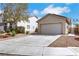 Attractive one-story house with a spacious driveway, two-car garage, and low-maintenance landscaping at 6314 Shadow Moon Pl, North Las Vegas, NV 89031