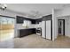 Modern kitchen features sleek cabinets and stainless steel appliances, with backyard access at 6314 Shadow Moon Pl, North Las Vegas, NV 89031