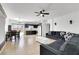 Open-concept living space with a breakfast bar and stainless steel kitchen appliances at 6314 Shadow Moon Pl, North Las Vegas, NV 89031