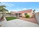 This well-maintained backyard features a covered patio and a mix of concrete and gravel landscaping at 635 Dry Valley Ave, North Las Vegas, NV 89031